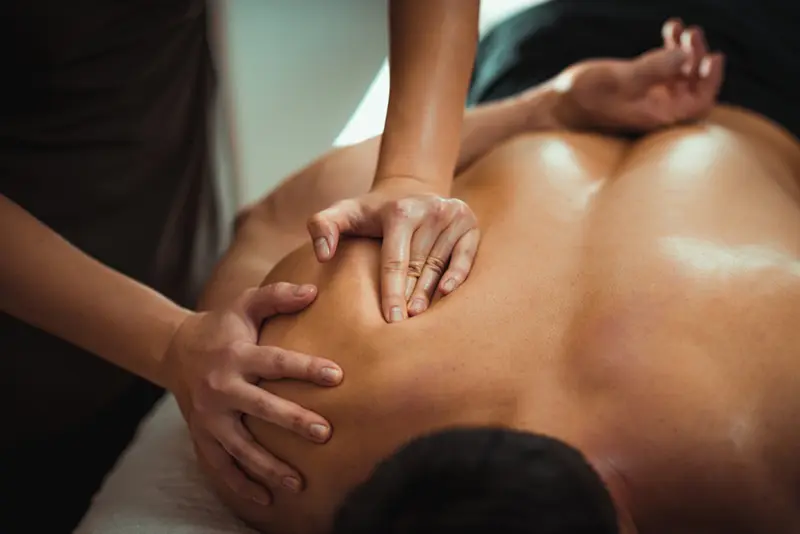 deep-tissue-massage Massage therapist in Stuart FL provides deep tissue massage to a client